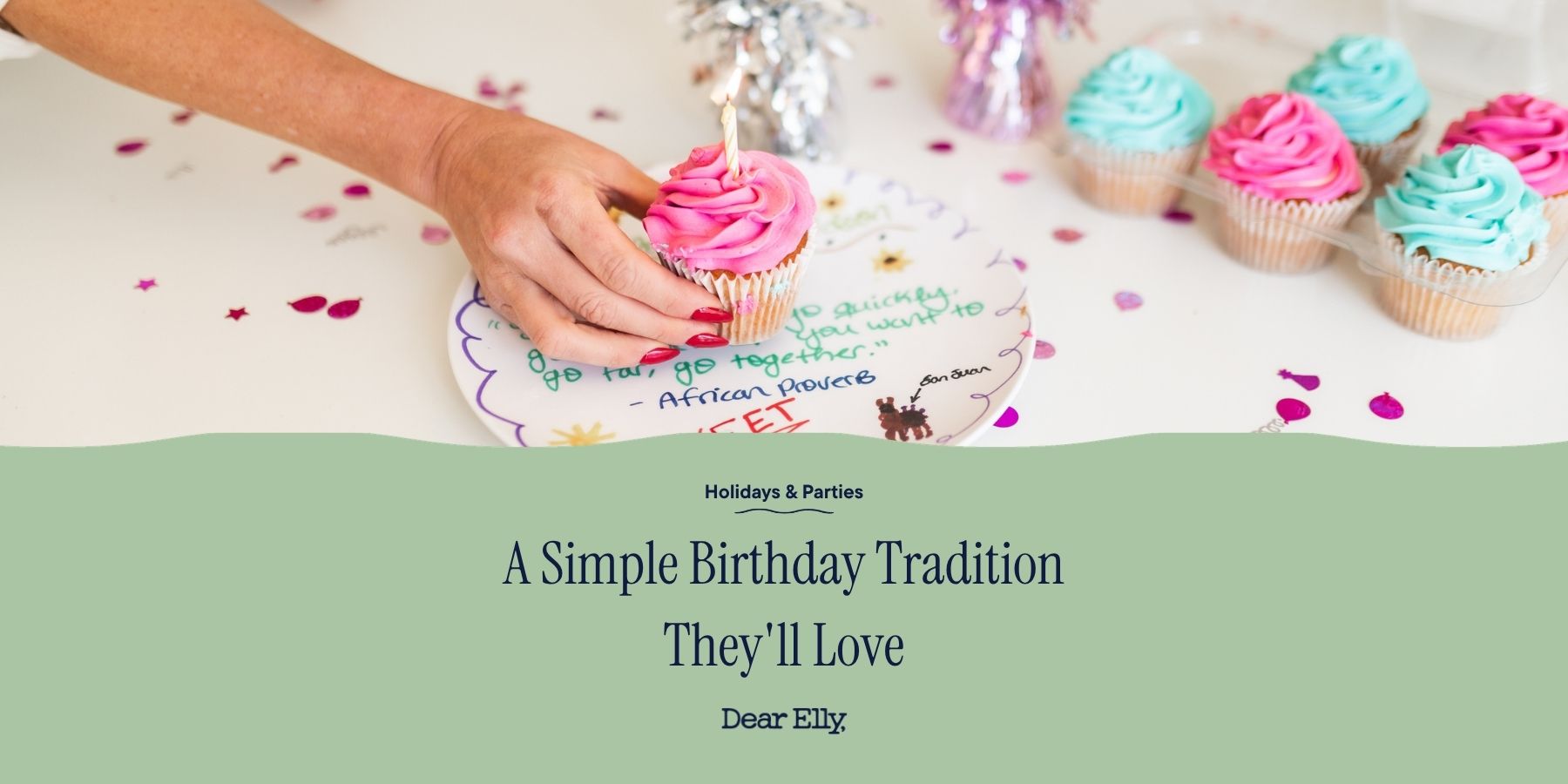 Hand holding a birthday cake with lit candle, surrounded by colorful cupcakes on a festive background.