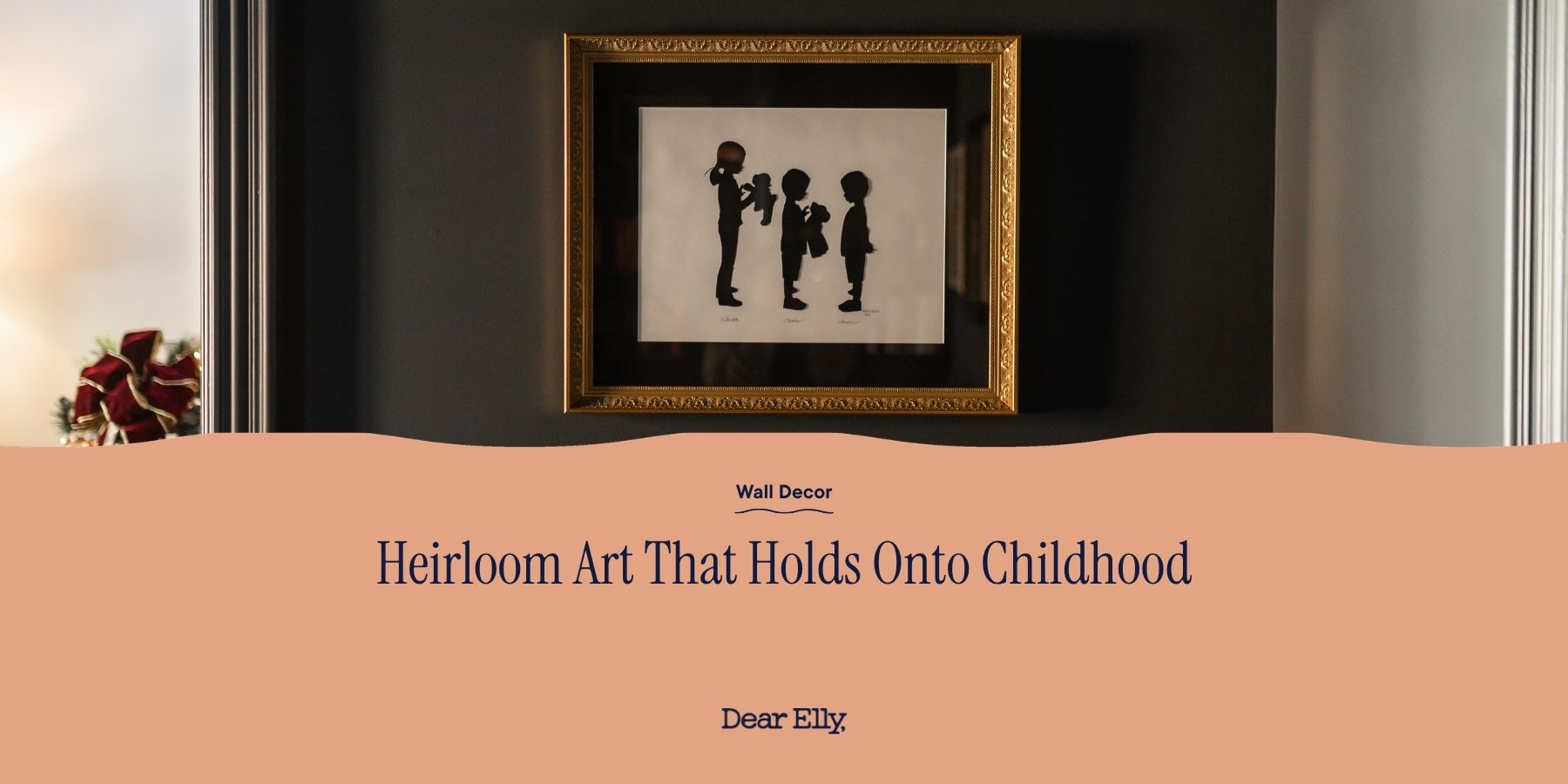 Framed silhouette art of two children holding hands on a wall with text 'Heirloom Art That Holds Onto Childhood' and 'Dear Elly'.